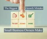 overwhelmed small business owner multitasking with phone and paperwork at office desk