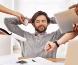 Overwhelmed entrepreneur managing multiple tasks alone representing business growth bottleneck and lack of delegation