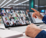 Business owner managing a productive remote team through virtual meetings and online collaboration tools